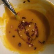 Creamy pumpkin soup with ginger and chilli honey